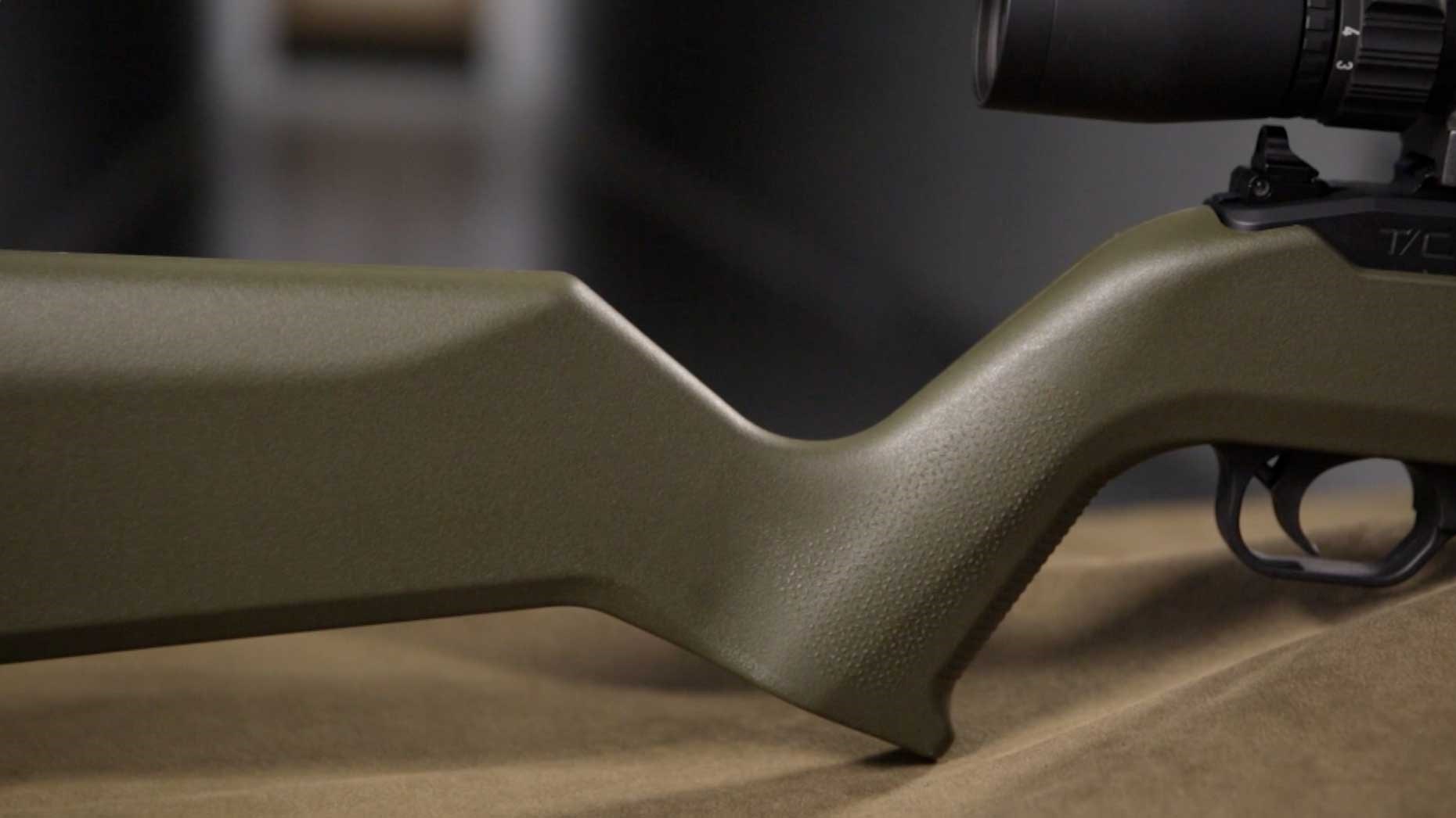 The steep pistol grip and angular lines of the green Magpul stock displayed on the T/CR22.