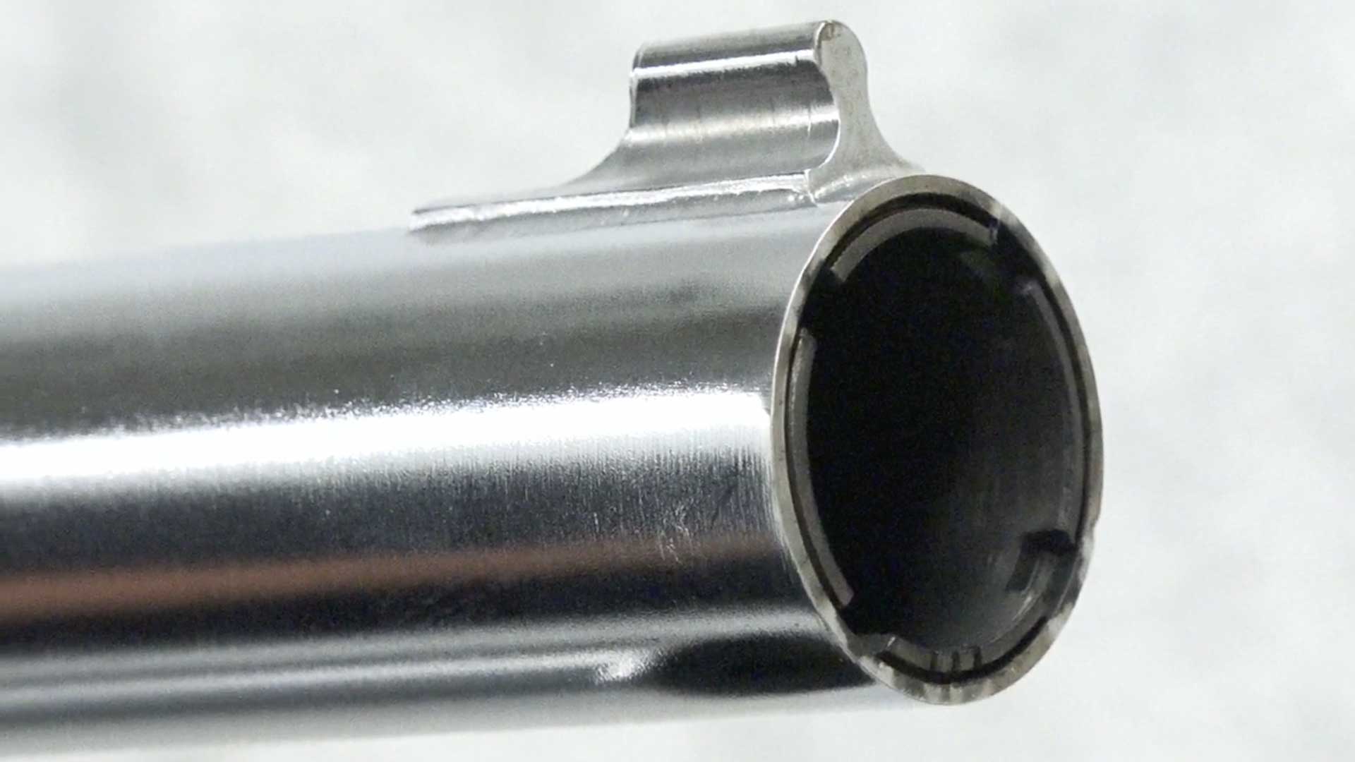 silver pipe barrel gun shotgun