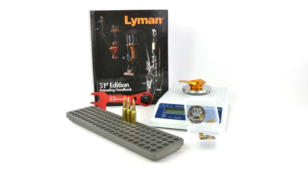 5 reloading tool lyman book scale cartridges wrench gauge shown on white background