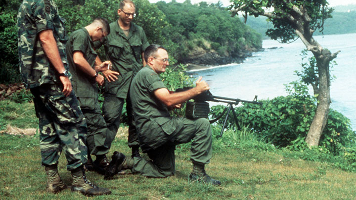 Officers and men of the 82nd Airborne test out a captured PKM machine gun (with a 100-round ammunition belt container).