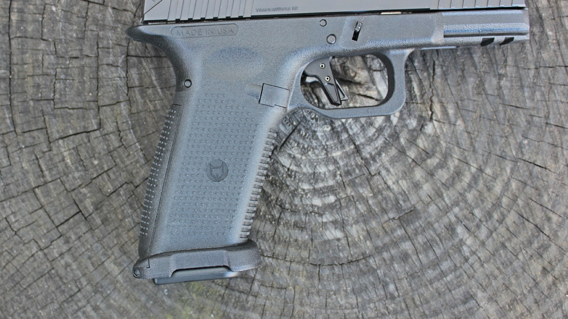 Timberwolf 19x pistol closeup of grip texturing and trigger
