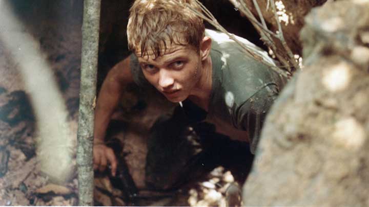 Coming out of a maze of caves and tunnels in the Hobo Woods, a M1911-armed GI of the 25th Infantry Division shows the strain of fighting the underground war in Vietnam. October, 1967.