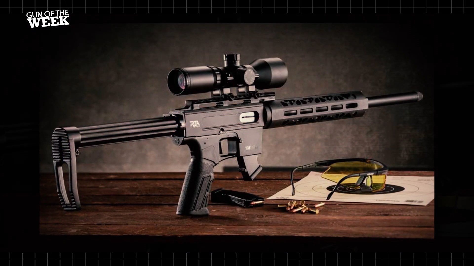 Rock Island Armory TM22 rifle rimfire semi-auto carbine shown on dark table ominous with target shooting glasses and ammunition