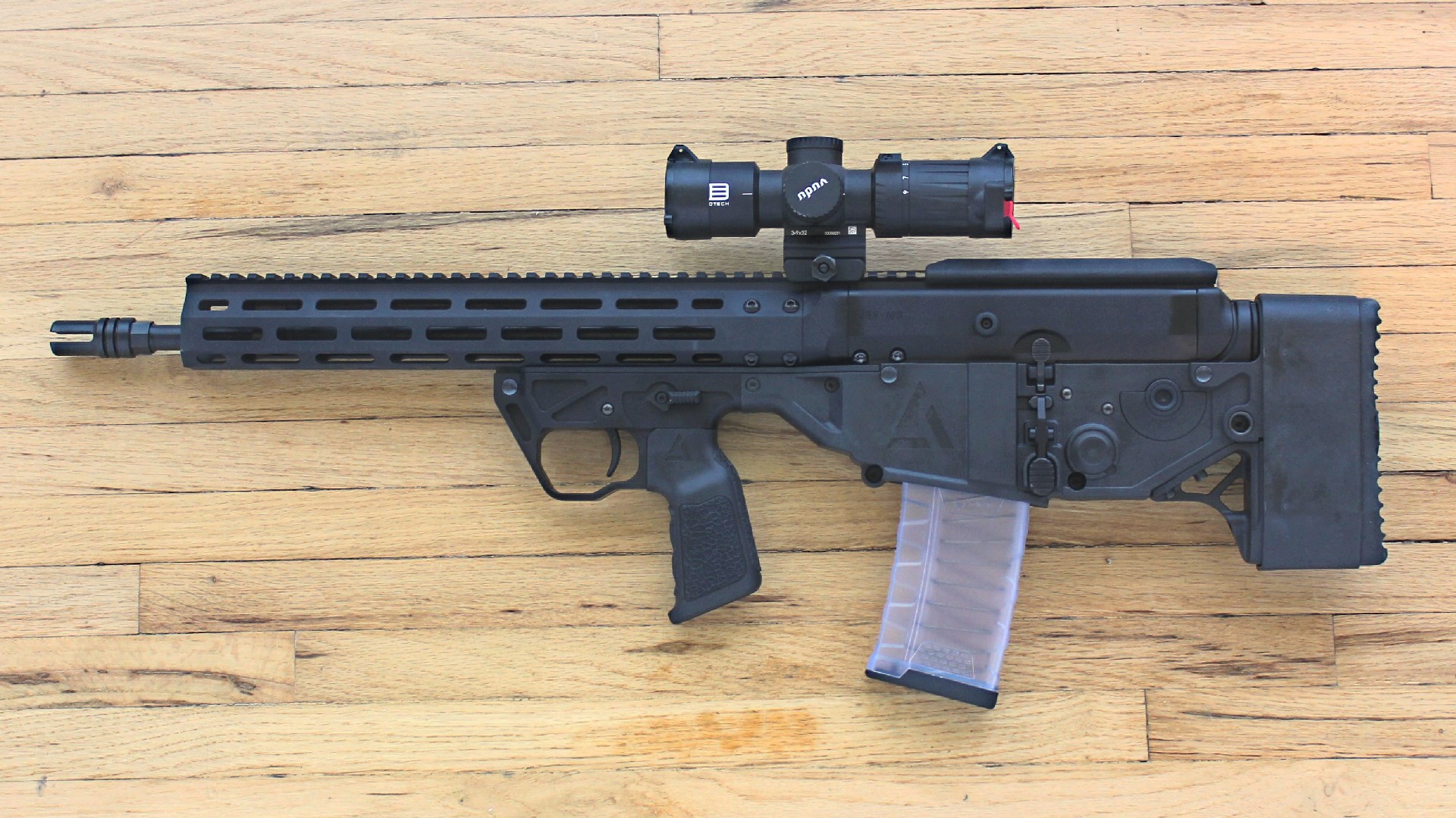 A3 Triad Bullpup chassis carbine ar-15 left-side view shown with clear magazine and Eotech Vudu riflescope attached to Picatinny rail