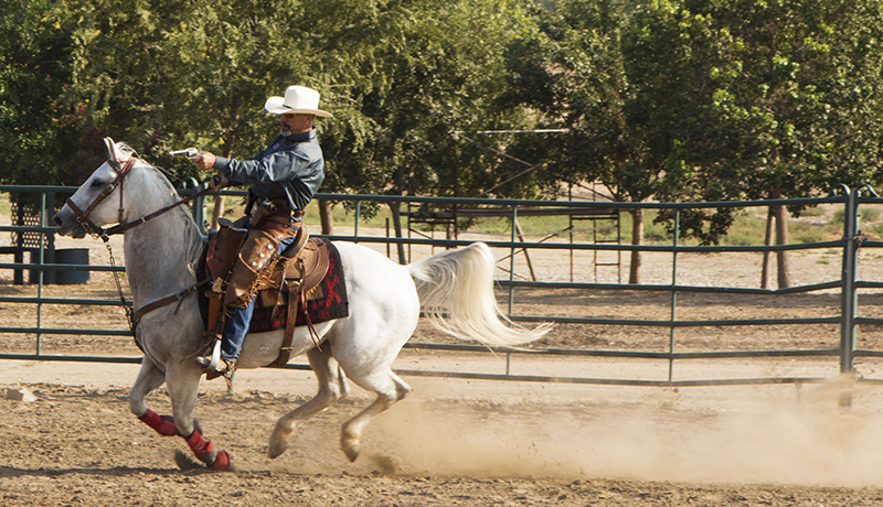 Cowboy Mounted Shooting with a Pistol