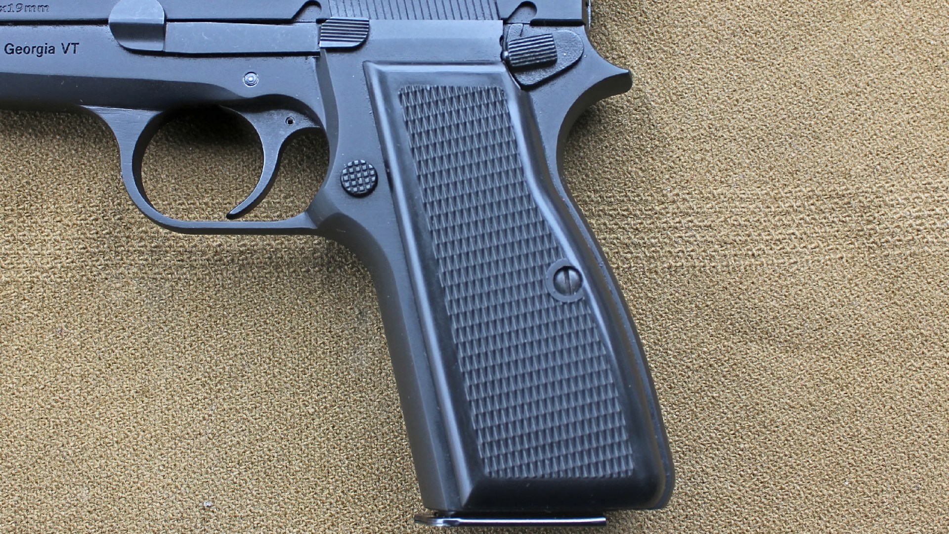Century Arms Centurion 14 left-side closeup of grip controls black gun pistol high-power clone