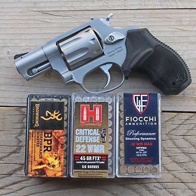 The Taurus 942 with the three different .22 Mag. ammunition selections used in testing.
