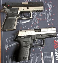 two guns side by side semi-automatic pistols handguns right-side view