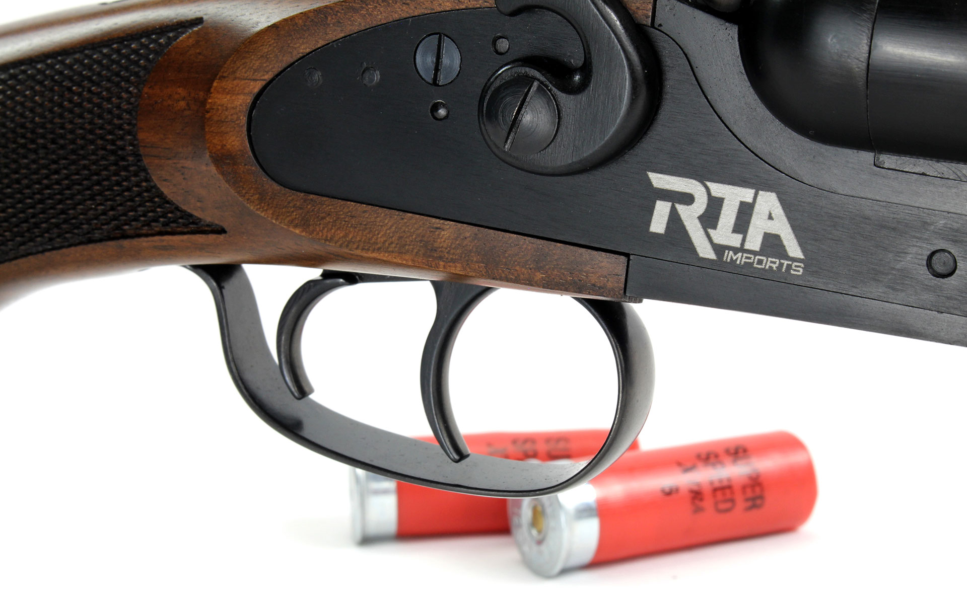 Rock Island Armory Side-By-Side 12 gauge shotgun double barrel view of dual triggers and two shot shells.