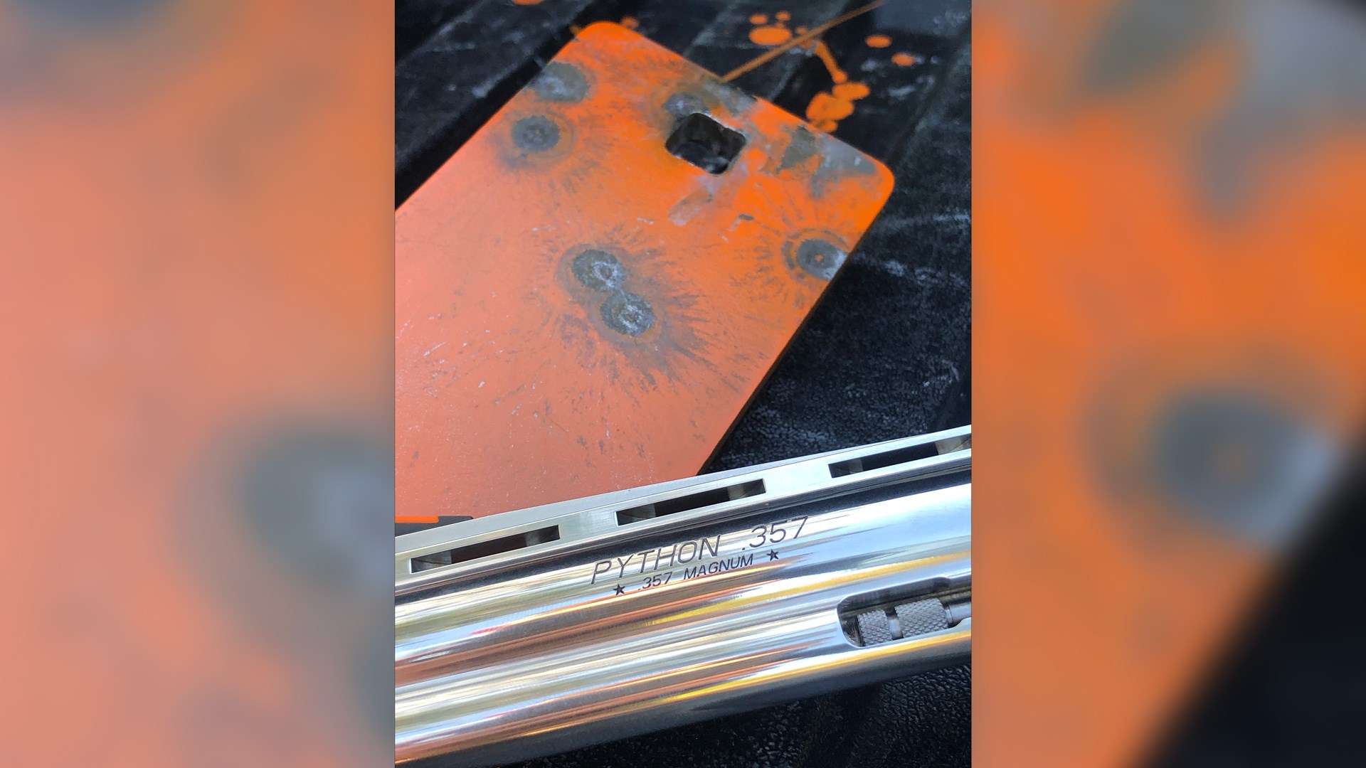 Colt Python barrel stamp stainless steel orange steel target background