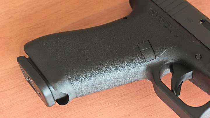 The grip of the Glock P80 lacks finger groves and features a subdued texturing on the smooth surface.