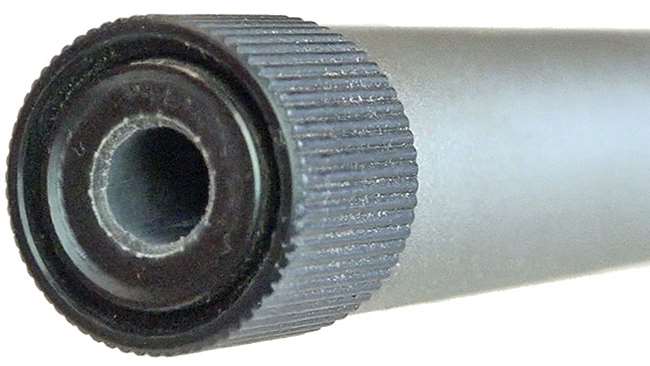 Silver barrel on white backround showing muzzle with black thread protector.