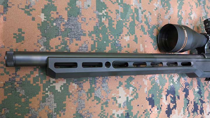 The M-LOK compatible forend of the chassis with a QD hole visible.