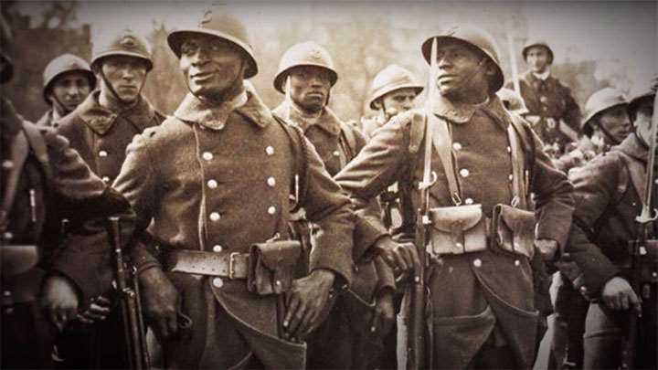 African decent soldiers wearing French gear and uniforms mixed with French soldiers.