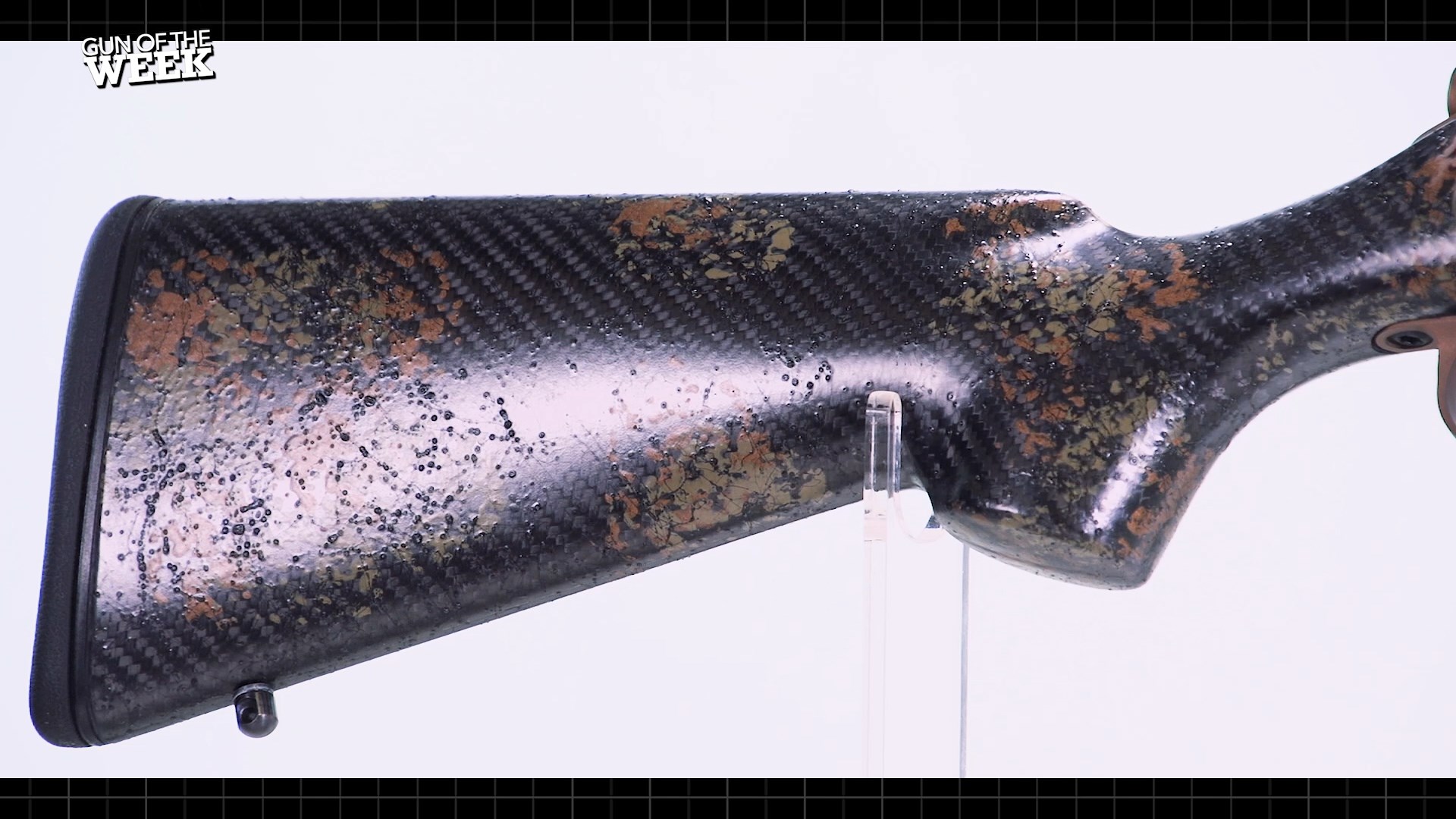 Howa M1500 Super Lite Carbon buttstock gun parts closeup detail paint carbon fiber splatter texture sheen