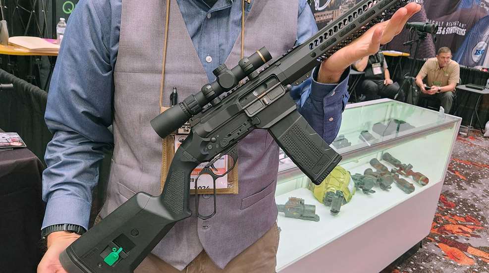 BOND ARMS LVRB lever-action ar-style rifle shown at SHOT Show 2024 booth convention man holding