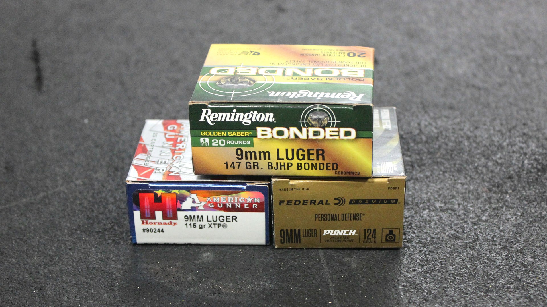three ammunition boxes stacked arrangement remington hornady federal