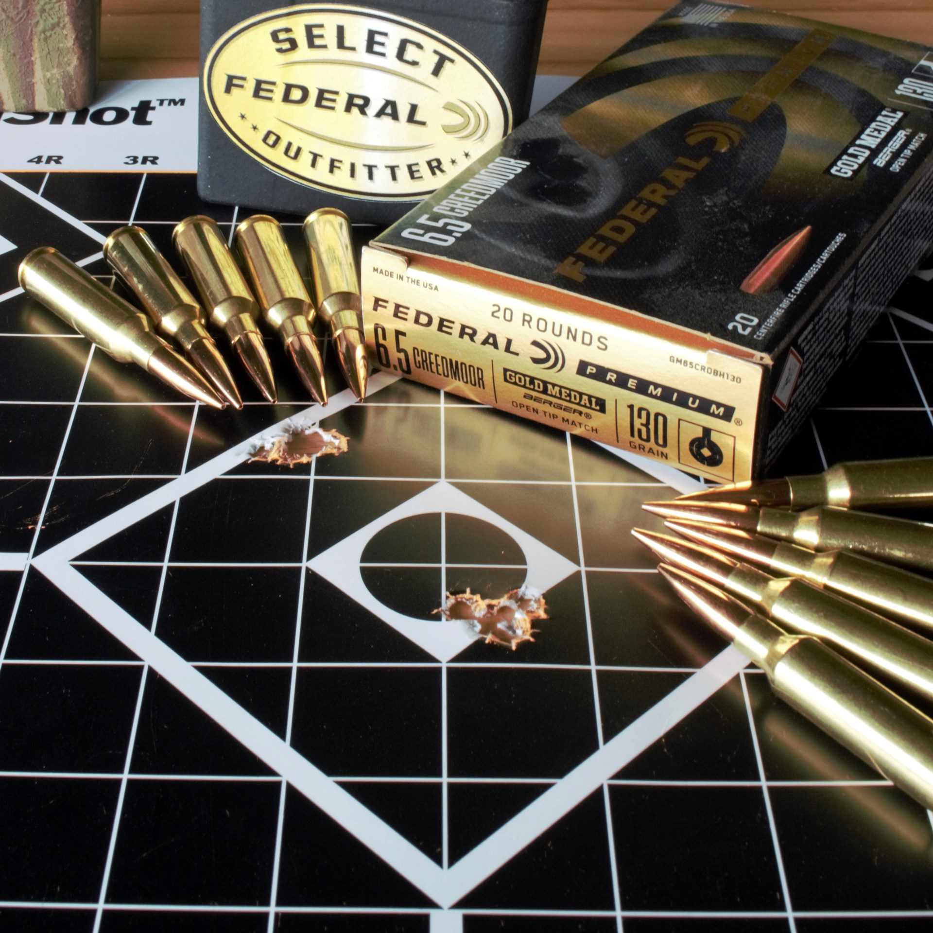 Black grid target with diamond group federal premium berger gold medal match ammunition table cartridges 6.5 mm Creedmoor bullets