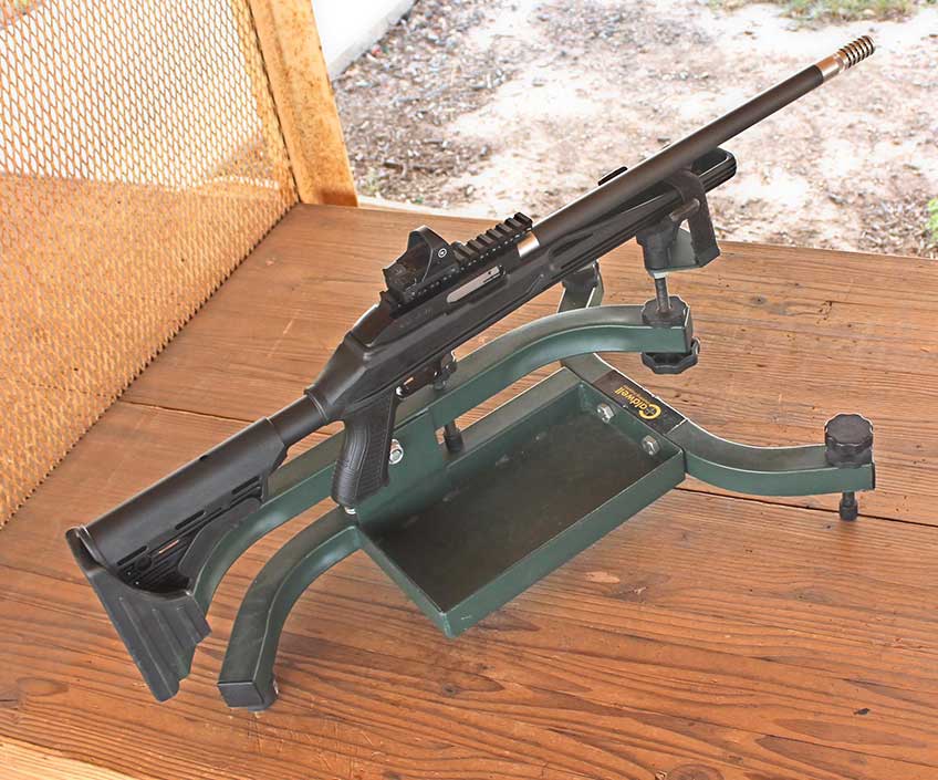 gun in cradle shooting outdoors table bench snow