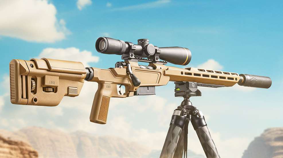 Springfield Armory Model 2020 Heatseeker bolt-action rifle Coyote Brown color fixed on tripod outdoors with a Leupold riflescope attached.