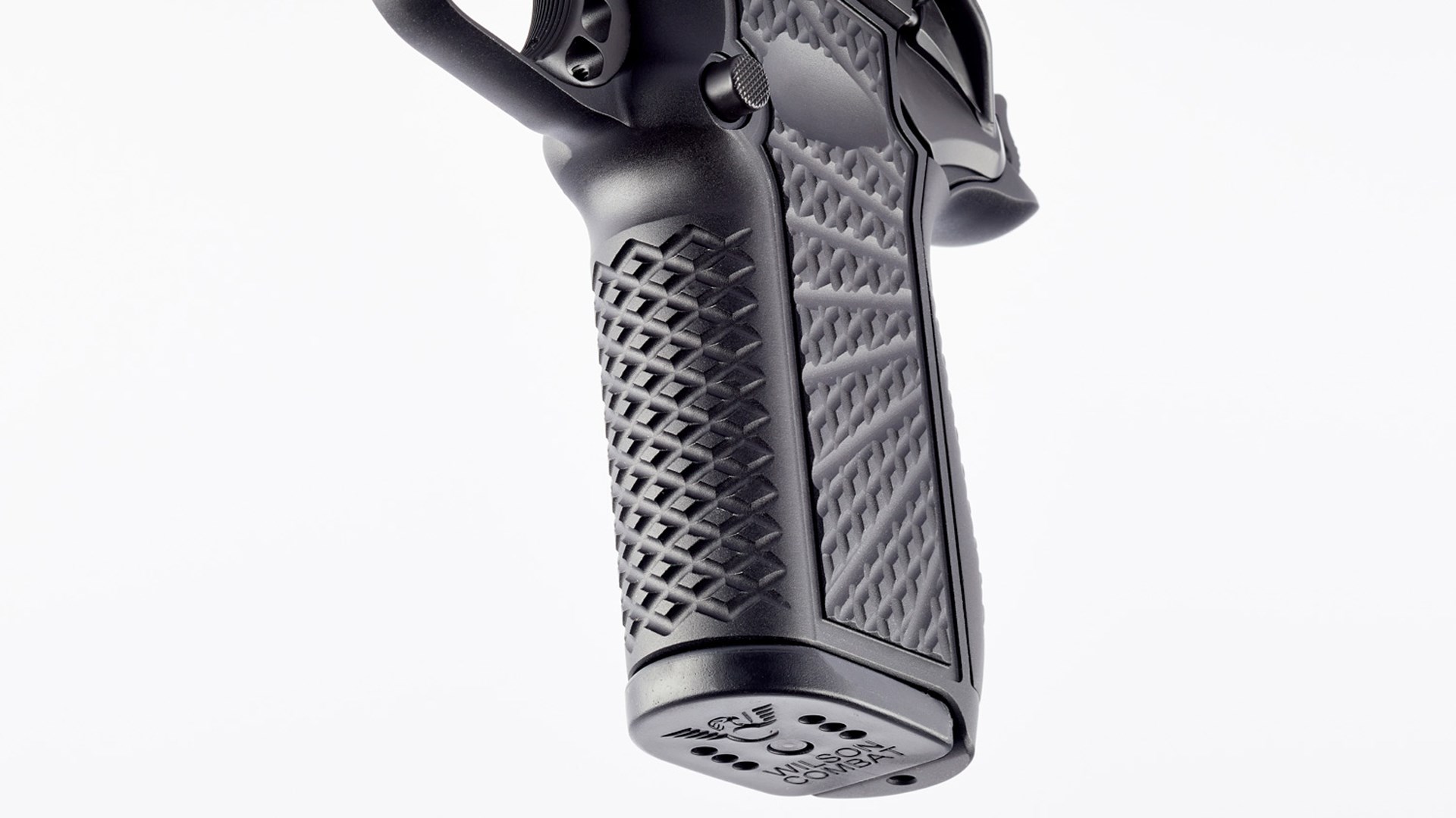 Wilson Combat SFX9 handgun pistol black gun frame grip serrations pattern texture starburst trigger magazine baseplate