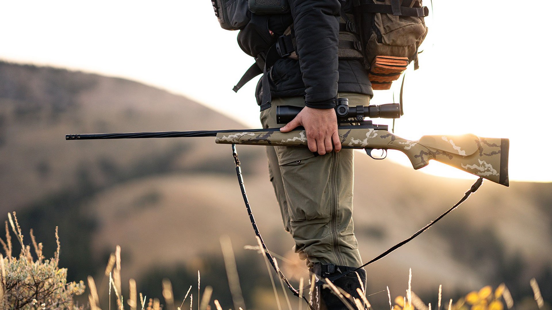 A hunter carries the Weatherby Vanguard Outfitter rifle into the field.