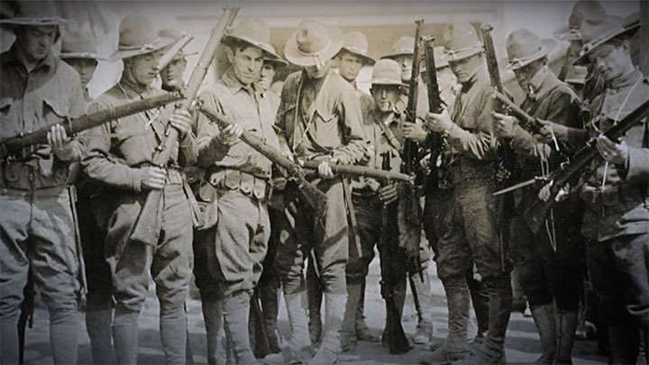 U.S. soldiers inspecting British Short Magazine Lee Enfield rifles.