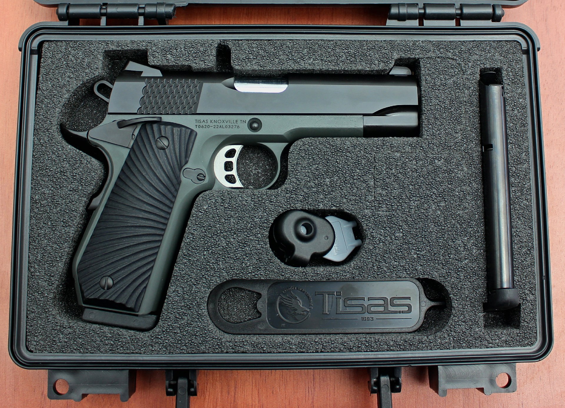 Right-side view of m1911 tisas pistol in foam case molded parts accessories
