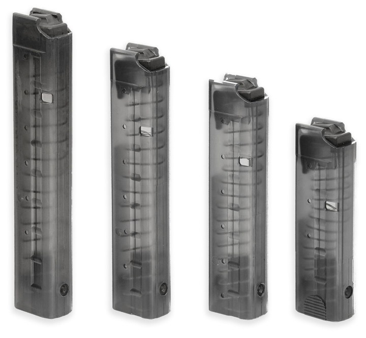 Four pistol magazines standing in a picket fence arrangement from most capacity (left) to shortest and least capacity (right).