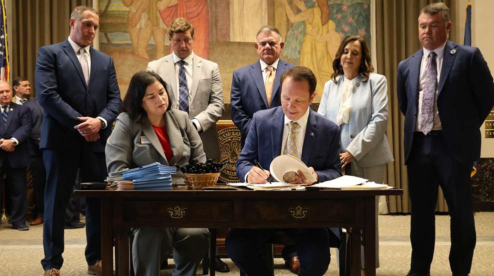 Louisiana legislature people men women suits fancy indoors signing laws