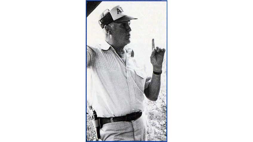 Col. Jeff Cooper teaching at Gunsite Academy with a 1911 holstered on his hip.