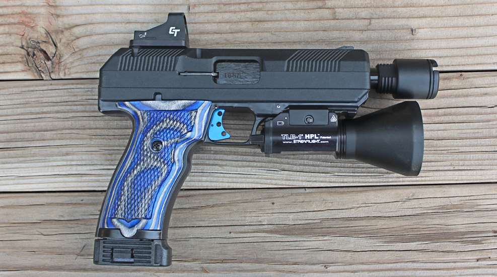 Hi-Point Firearms JXP 10 right-side view modified pistol shown with blue wood stocks muzzle device red-dot optic and flashlight on wood boards
