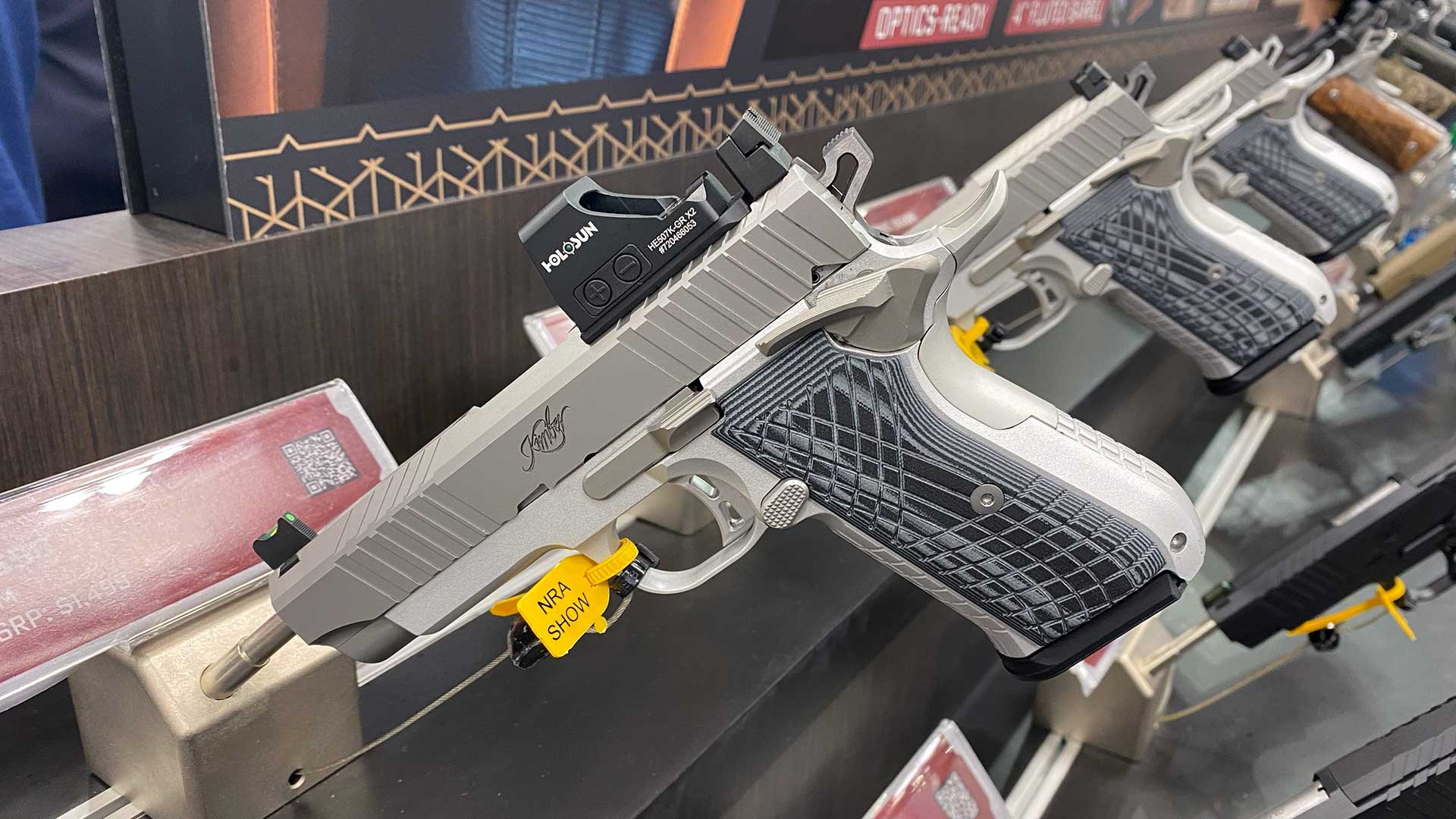 A Kimber KDS9 double-stack silber handgun shown on a display at the 2023 NRA Annual Meeting & Exhibits