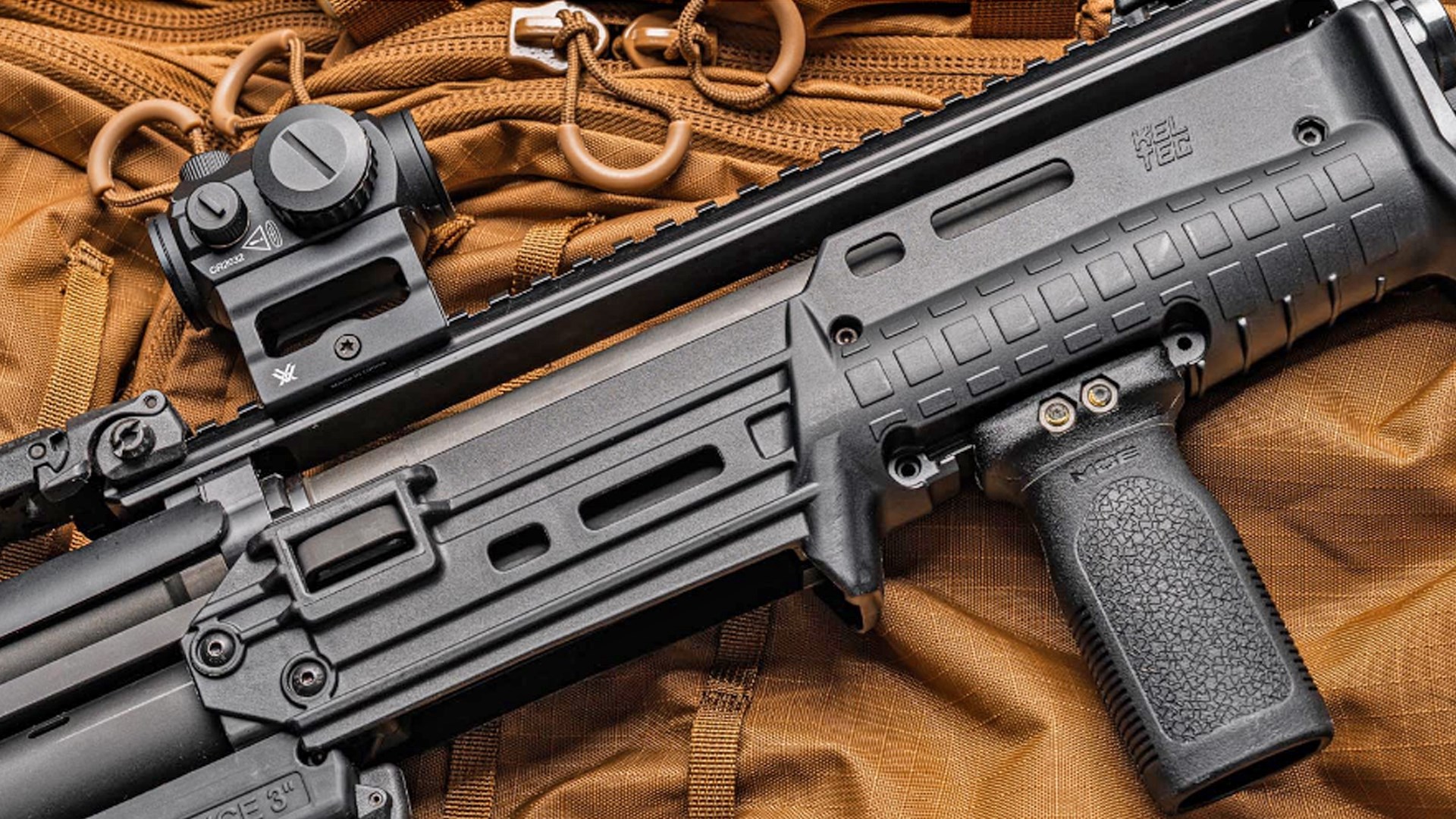 KelTec KS7 Gen2 shown with red-dot optic and grip on the fore-end.