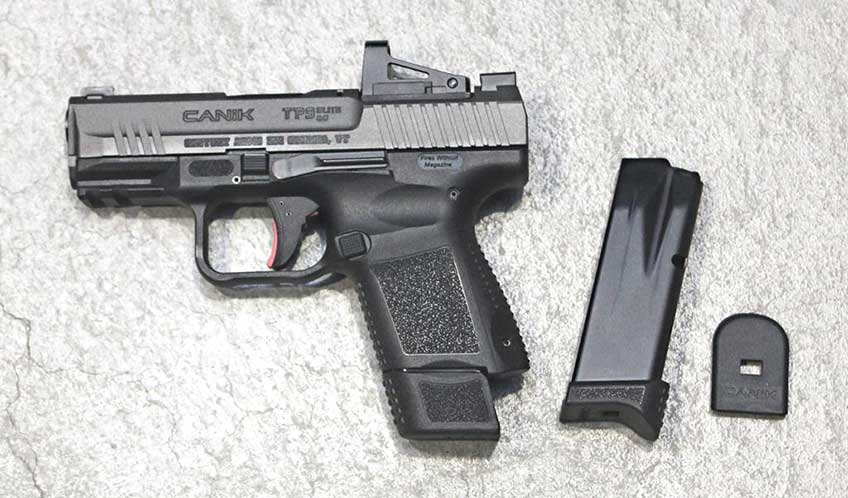 Left side view of the Canik TP9 Elite SC with the extended 15 round magazine inserted and the 12 round magazine to the right for comparison.