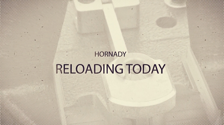 Text on faded reloading press image stating &quot;Hornady: Reloading Today&quot;