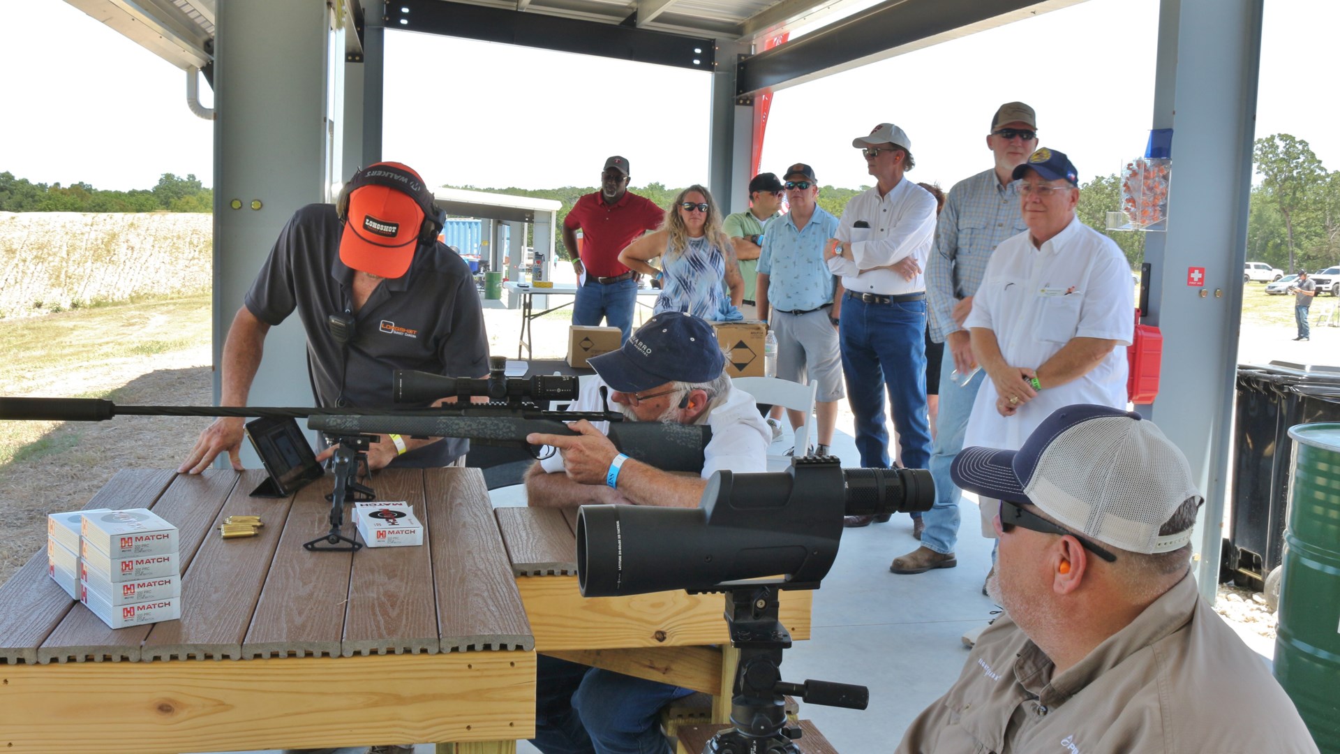 Sellmark Ranch grand opening people shooting under covered line