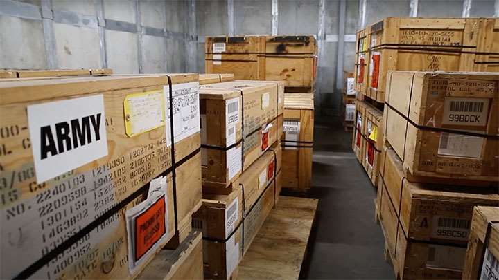 Crates of 1911 pistols from the U.S. Army sitting inside the CMP 1911 vault.