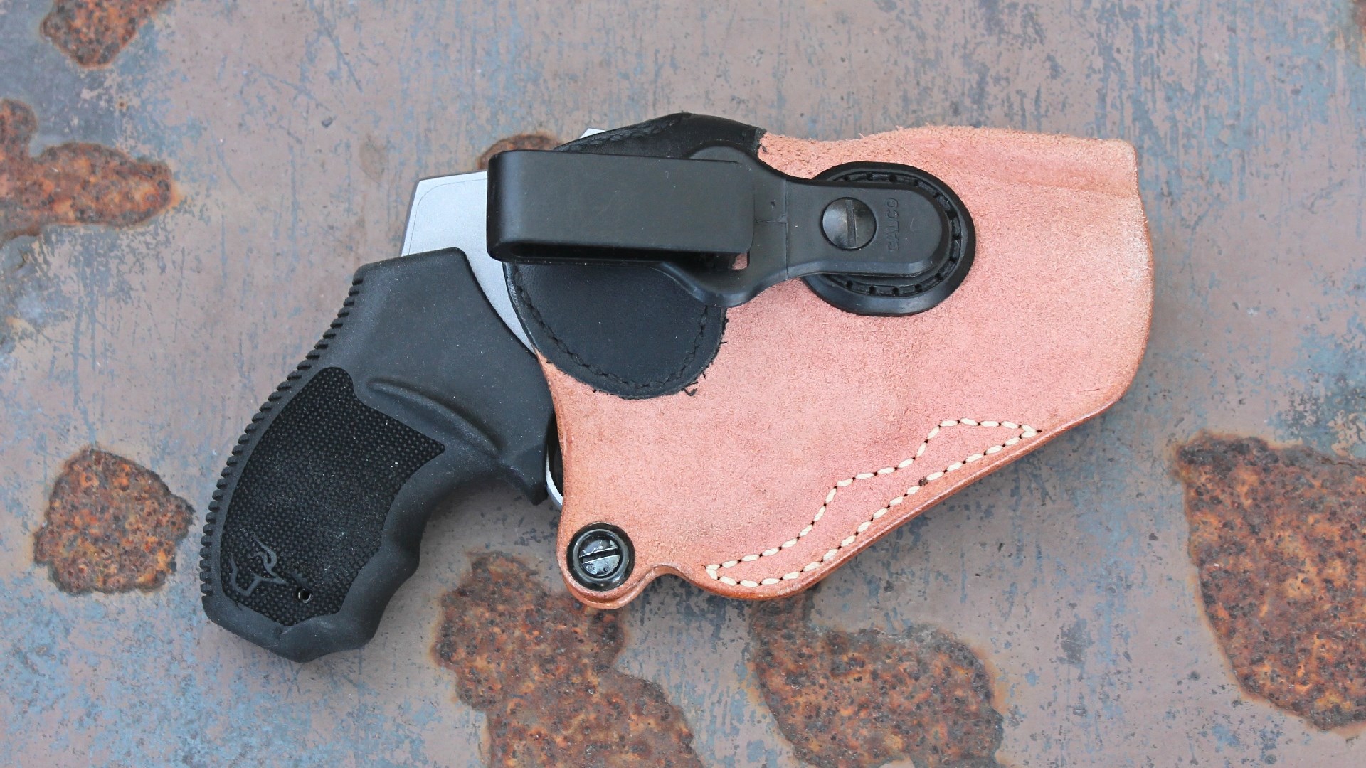 The Taurus 605 revolver inside of a Galco leather holster.