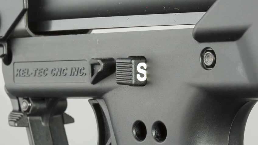 black plastic parts of shotgun safety button white "S"