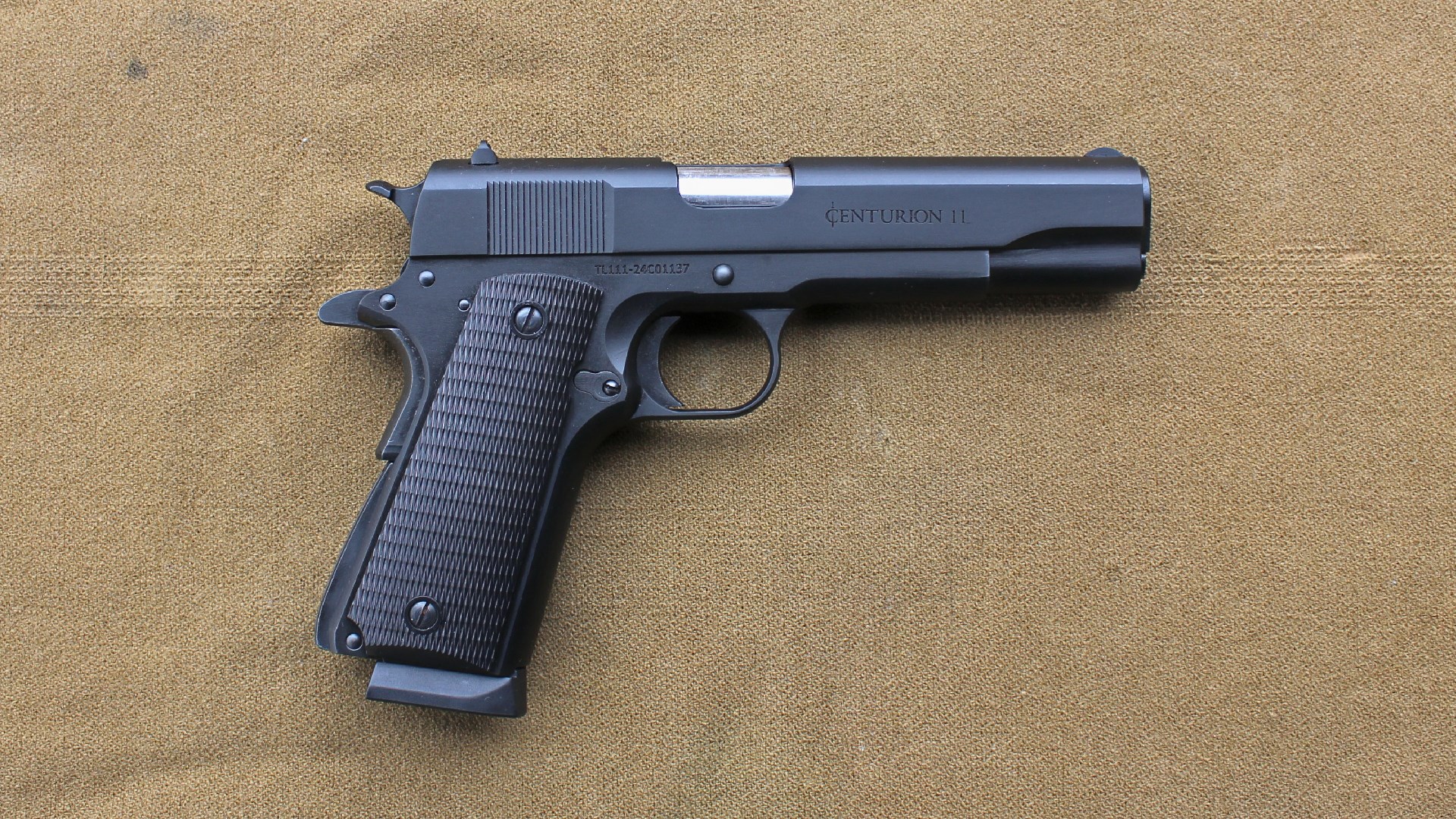 Century Arms Centurion 11 right-side full-length view 1911-style pistol gun on brown tan background