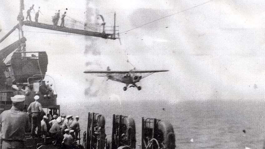 A Piper L4 Grasshopper reconnaissance aircraft attached to the Broadie landing system.