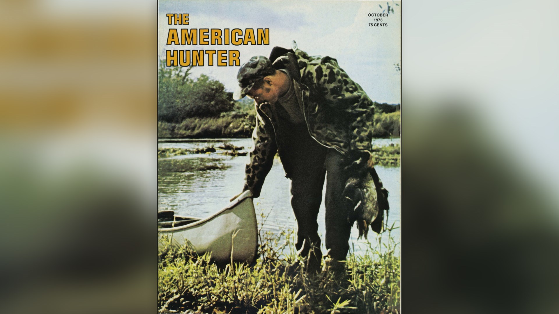 The American Hunter magazine cover man hunter camouflage ducks water boat canoe grasses outdoors river pond lake