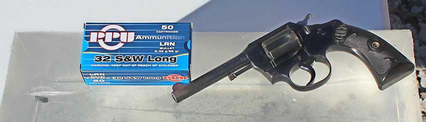 Colt Police Positive revolver left-side view on ballistic gel ammunition box blue
