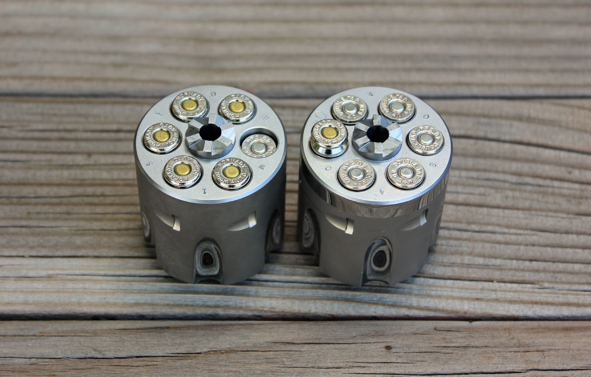 The .40 S&W's .850" long cartridge case gets swallowed up in the 10 mm cylinder (Left) while the .992" case of the 10 mm protrudes too far from the .40 S&W  chambered cylinder (Right).