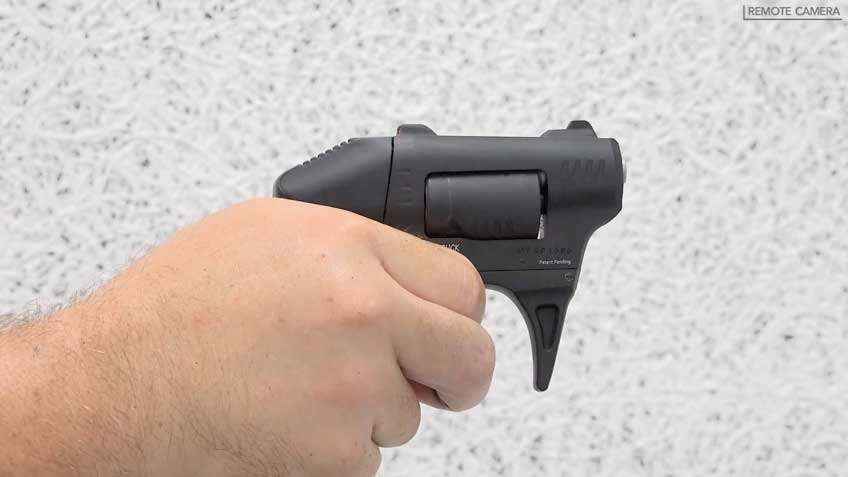 black revolver in hand