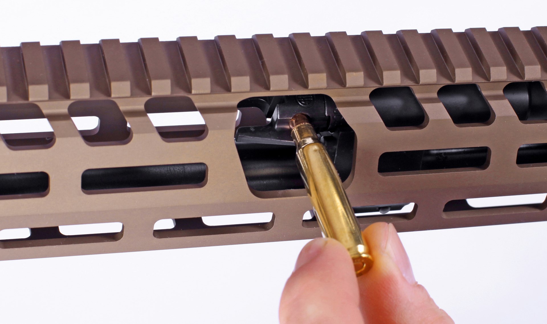 closeup of sig sauer rifle part adjustment fingers brass ammo setting adjustment demonstration