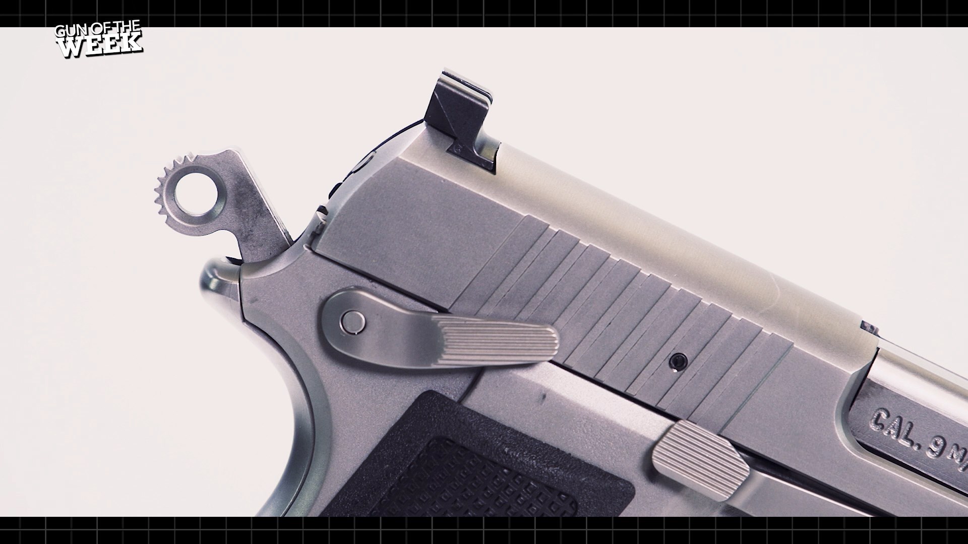 fn america high power pistol stainless steel finish gun closeup hammer spur safety parts rear sight