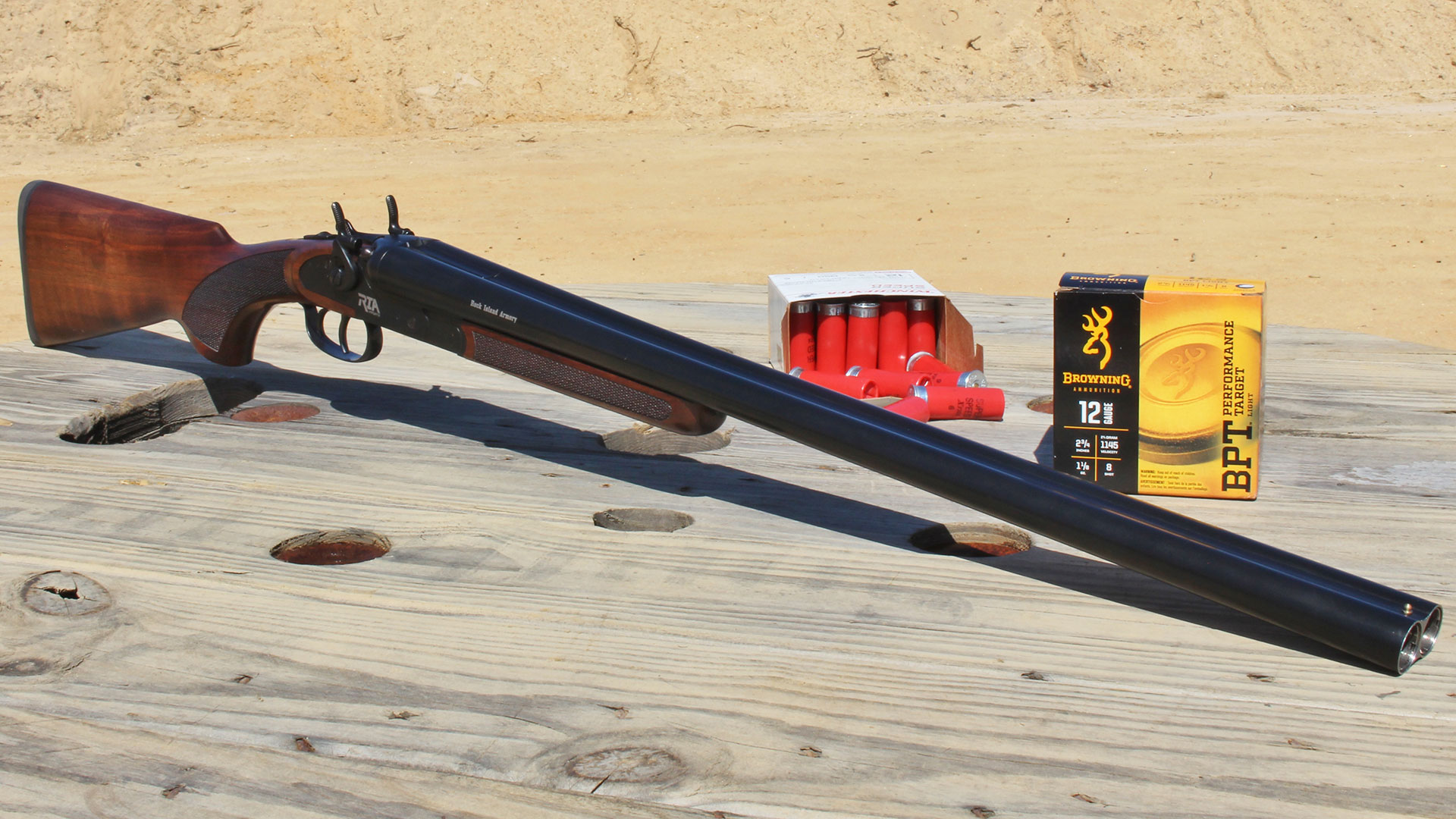 Rock Island Armory Side-By-Side 12 gauge shotgun double barrel on table with ammo.