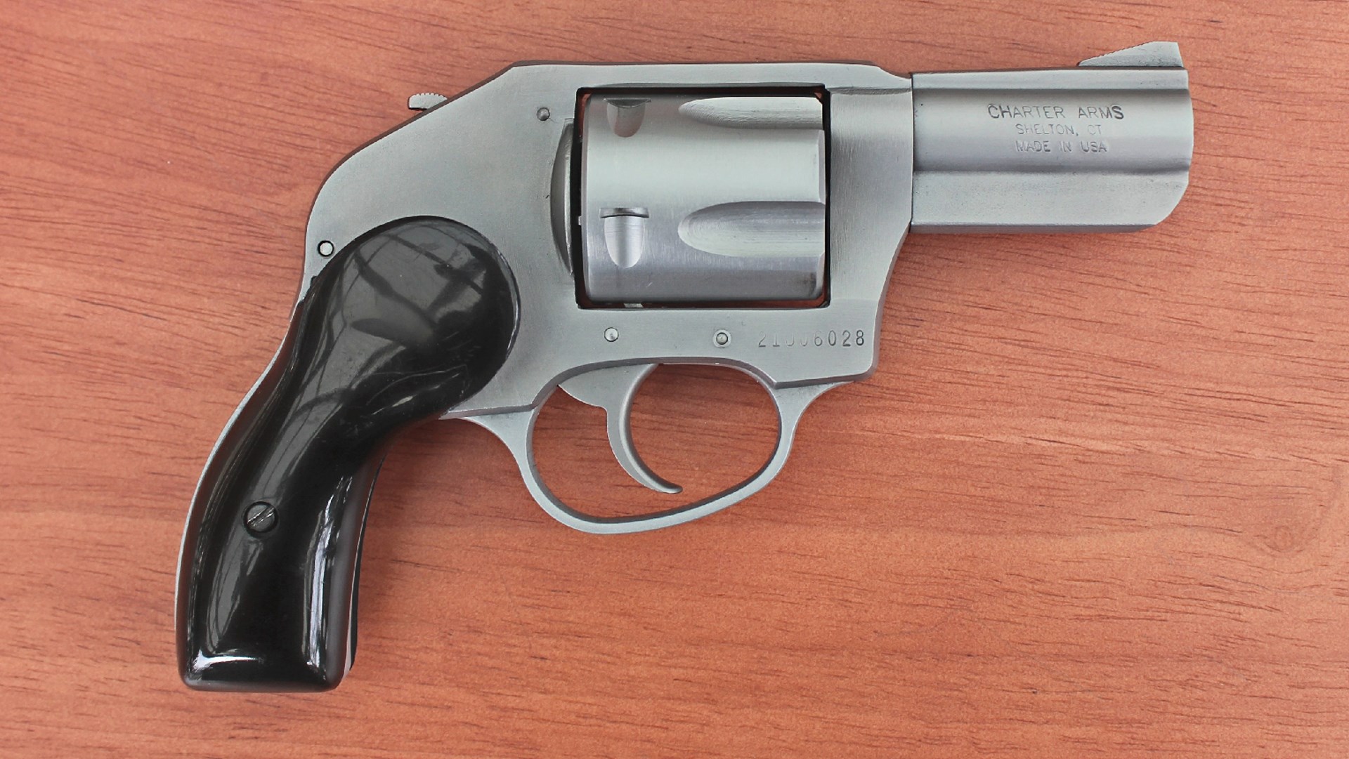 right-side view of charter arms bulldog 44 magnum revolver gun stainless steel on wood table